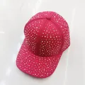 Macro shot of hot pink baseball cap with shimmering rhinestones and curved brim - Adult Size (Adjustable) / Red