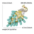 Elegant peacock brooch with turquoise stones and pearl, dimensions and weight details - Blue