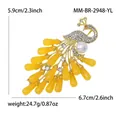 Elegant peacock brooch in gold alloy with white rhinestones and yellow stones - Yellow
