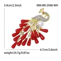 Peacock brooch with white pearls and red crystals in golden finish, 5.9x6.7cm - White Bead Red