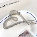 Pinza para el pelo de acrílico gris transparente con resorte metálico dorado - 12cm / Gris