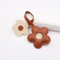 Close-up of brown and cream leather flower pendant with exquisite handmade stitching details - Coffee Beige