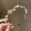 Exquisite handmade headband featuring white resin flowers and faux pearl beaded accents - Pearl Flower