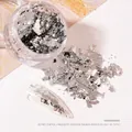 Jar of silver foil flakes for nail art decoration and creative cake toppers - Broken Silver