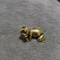 Macro view of vintage brass money toad tea pet with detailed metallic texture - Thinking Frog