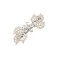 Macro shot of silver leaf hair clip with pavé rhinestones and floral center detail - Silver White Rhinestone