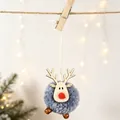 Close-up of a blue felt ball reindeer ornament with wood antlers on a holiday string - Blue
