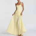 Detail of elegant pale yellow maxi dress featuring pleated waist and flowing wide skirt - Yellow