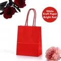 Bright red white kraft paper gift bag with twisted handles and floral decor - Brilliant Red