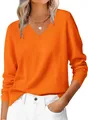 Close-up of bright orange V-neck knit sweater featuring ribbed cuffs and neckline texture - S / Orange Red