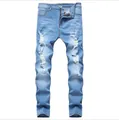 Slim fit herenjeans in lichtblauw met gescheurde knieën en vervaagde denim textuur - EU 38 / Lichtblauw