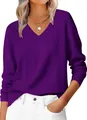 Close-up of deep purple V-neck knit sweater featuring ribbed cuffs and collar details - S / Purple