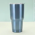 Detail view of 30oz blue stainless steel travel mug with lid and slide switch - Light Blue