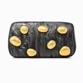 Detail of marble textured acrylic clutch with decorative golden pebble embellishments - Black