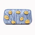 Detailed macro of marble acrylic clutch bag featuring organic golden metal decorations - Sapphire Blue