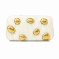 Detail of white marble acrylic clutch featuring gold pebble-shaped metal accents - Milky White