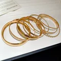 Gold plated bracelet set featuring smooth, matte, and twisted metal texture rings - Multi-Layer Combination Set Style (43#) / Gold