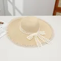 Elegant beige straw sun hat with white lace ribbon bow and pearl edge detail - Pearl Ring Beige