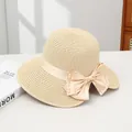 Beige wide brim straw sun hat with large pearl-embellished ribbon bow detail - Sixteen Beige Beads