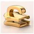 Makro-Detail des polierten goldenen Edelstahl-Reißverschlussschiebers für Gepäckstücke - US 5 / Standardtyp / Gold
