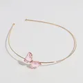 Serre-tête fin en métal doré orné d'un papillon en cristal rose pâle facetté - Papillon Rose
