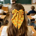 Gelbe Einschulung Haarschleife mit Schreibwaren-Prints und langen Bändern für Mädchen - Gelber Schulstart-Druckstil
