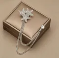 Elegant silver star brooch with sparkling rhinestones and delicate double chain detail - Star Chain Brooch / Silver