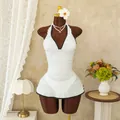 Detail of white halter neck swimsuit with ruffled V-neck and contrast black trim - S / White