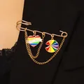 Golden punk safety pin brooch with Love Wins heart and rainbow charms on a black blazer - Rainbow Pride Style 3 (KC Gold)
