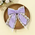 Detail of multi-layered lavender satin bow hair clip with white lace trim for women - Purple