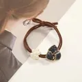 Brown elastic hair tie with white pearl flower and black marble triangle pendant - Black Triangle Stone