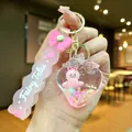 Pink strawberry quicksand keychain featuring floating glitter and cartoon fairy tale charm - Pink Strawberry-style Airplane Fabric Bow
