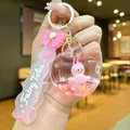 Pink rabbit in apple liquid quicksand keychain with Fairy Tales printed wristlet - Pink Airplane Fabric Bow Rope [apple]