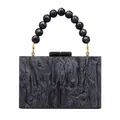 Chic marbled acrylic evening clutch with beaded wrist handle and gold metal hardware - Black