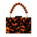 Elegant tortoiseshell acrylic clutch bag with amber beaded handle and gold hardware - Amber