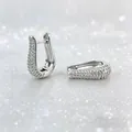 Detail of silver plated U-shaped huggie earrings with pavé set micro cubic zirconia stones - U-Shaped Full Rhinestone Style / Silver