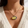 Close-up of gold Angel Devil's Eye pendant necklace with blue and yellow enamel details - Yellow Blue Contrast (ADD-202G-10)