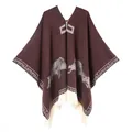 Detailed knit texture of a brown poncho with ethnic wolf pattern and white tassels - 130x150cm / Wolf Pattern Pullover Tassel (Coffee)