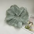Detail of silk hair scrunchie in mint green with crystal beads and smooth texture - Mesh Large Mint Green