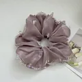 Detail of mauve satin scrunchie featuring shimmering fabric and iridescent crystal bead edges - Mesh Large Dusty Rose