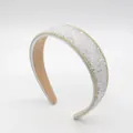 Elegant white padded headband with sparkling crystals and silver beaded edges - White