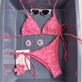 Pink daisy print two-piece halter bikini set with side tie bottoms and floral charms - Rose Red Daisy Embroidery