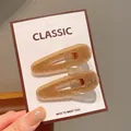 Chic gold glitter water drop hair clips set displayed on classic white card - Gold Fine Glitter Teardrop Hair Clips