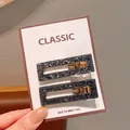 Minimalist grey acetate hair clips set with hollow rectangle design and golden metal base - Square Black Hair Clips