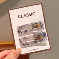 Rectangle hair clips in grey-blue marble texture on white display card with gold metal base - Gray Square Floral Hair Clips