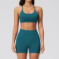 Women's seamless two-piece yoga set in deep teal with sports bra and high-waist shorts - S / Bra + Shorts / Soft Emerald Green