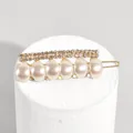 Elegant gold metal hair claw with sparkling rhinestones and white oval pearls - Pearl Rhinestone Style