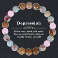 Macro detail of natural stone beaded bracelet with healing stones and vintage silver spacers - Pink Brown Red Blue Textured Beads (Depression-6)