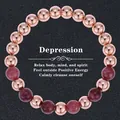 Detail of beaded bracelet featuring rose gold metal and dark purple natural stone beads - Rose Gold Purple Red Energy Beads (Depression-8)