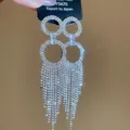 Silver color jellyfish tassel earrings with zircon crystals on a display card - Silver Double Ring Tassel Style (Silver Earring Post)